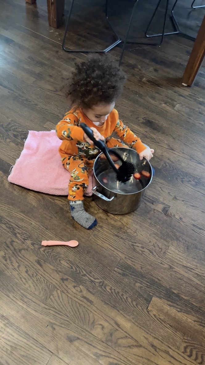 Young child helping with a cooking activity