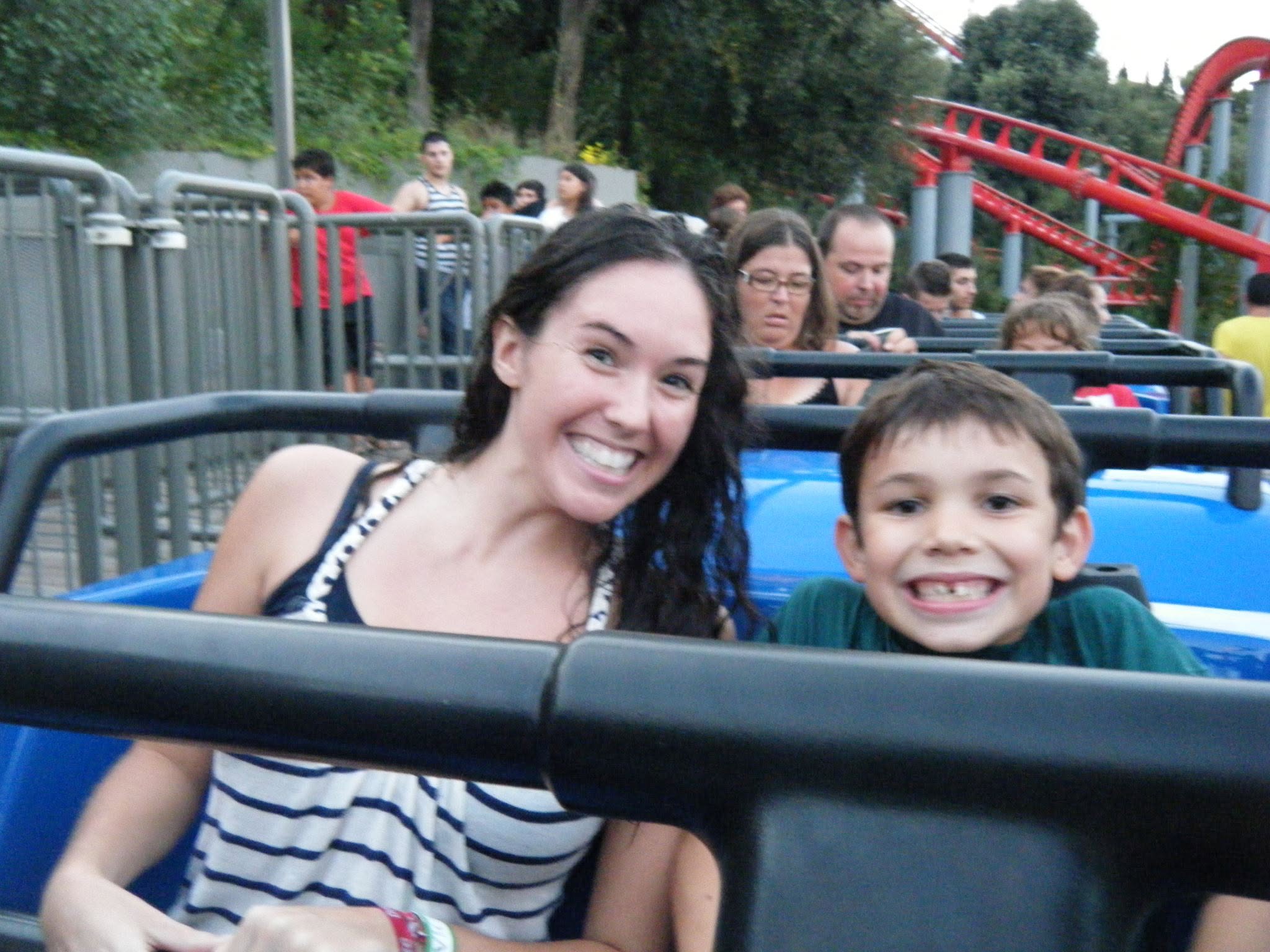 Nanny and child smiling on a rollercoaster